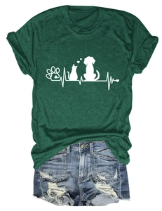 Detailed flat lay of dark green paw print and heartbeat graphic t-shirt with denim shorts