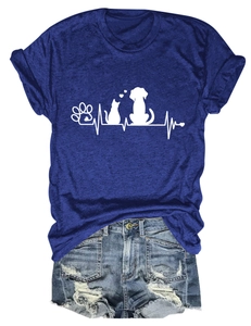 Flat lay of blue cotton T-shirt with pet paw prints and distressed denim shorts