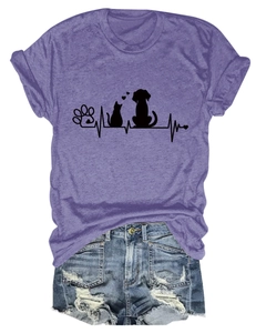 Detail of creative pet-themed print with paw prints and heart on purple summer t-shirt
