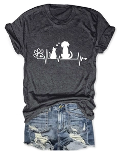 Flat lay of gray cat dog heartbeat print t-shirt paired with distressed blue denim shorts