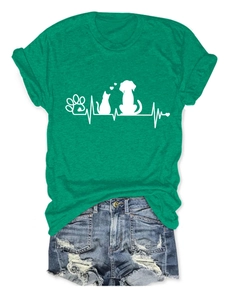Flat lay of a green cotton T-shirt featuring white pet paw prints and heartbeat graphics