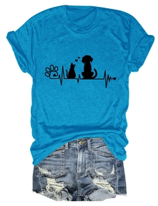 Detail of blue T-shirt with cat dog paw prints and heartbeat line paired with denim shorts