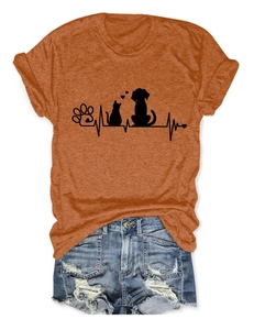 Detail of burnt orange cotton T-shirt featuring a black paw print and heartbeat graphic
