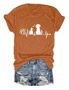 Detail showing orange cotton t-shirt with pet paw print and blue distressed denim shorts