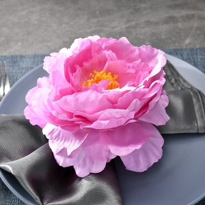 Elegant pink peony flower napkin ring on grey silk for wedding and hotel table decor