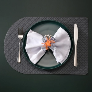 Macro shot of an orange glitter spider napkin ring on a plate for Halloween dining