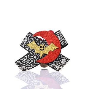 Halloween napkin ring with spider web bow, moon and bat elements for festive table setting