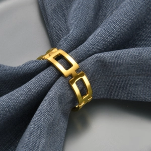 Golden square hollow geometric napkin ring made of polished alloy for elegant table decor