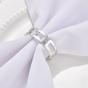 Macro shot of silver hollow rectangular napkin ring with a polished metallic finish