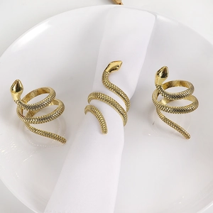 Elegant gold snake napkin rings with scale texture for luxury dining table decoration