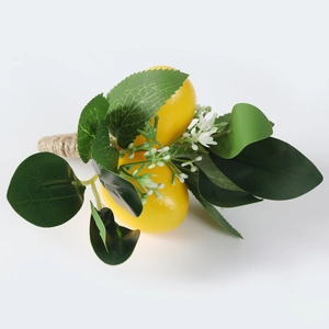Detail of handmade lemon napkin ring with realistic yellow fruit and jute twine base
