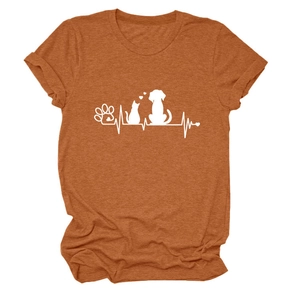 Close-up of burnt orange pet-themed T-shirt with white paw print and heartbeat graphics