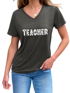 Detail of V-neck T-shirt showing Teacher text print and shamrock pattern design
