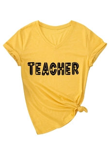 Detail of V-neck yellow Teacher t-shirt with clover letters and tied waist hem style