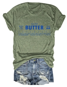 Détail de l'imprimé graphique Salted Butter sur un t-shirt vert foncé vintage