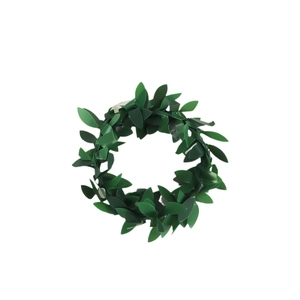Christmas greenery napkin ring with dense artificial green leaves for table decoration