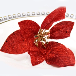 Sparkling red Christmas flower napkin ring with gold center for holiday table setting