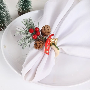 Christmas napkin ring with cedar, red berries, pine cone and bell on wooden hoop