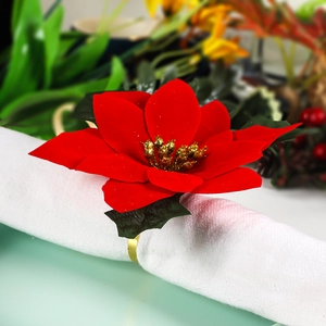 Red velvet poinsettia Christmas napkin ring with golden metallic base for table decor
