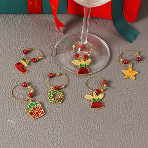 Set of 6 Christmas wine glass charms with festive star, wreath, and angel enamel pendants