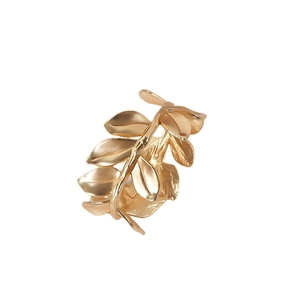 Elegant gold metal leaf napkin ring with detailed texture for luxury table settings