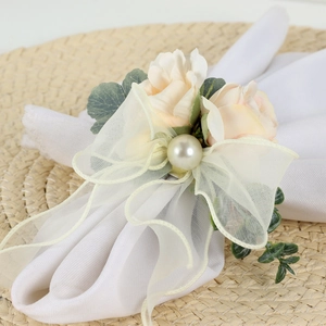 Elegant napkin ring with pink faux roses pearls and white tulle bow for wedding decor