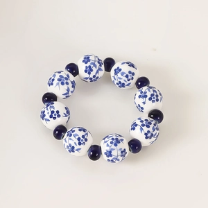 Oriental blue and white porcelain beaded napkin ring with elegant floral patterns