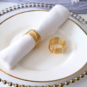 Golden spiral metal napkin rings with rhinestones for elegant wedding table settings