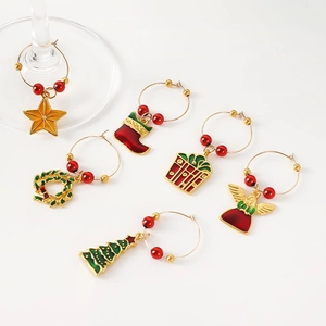 Detail of 6 Christmas wine glass markers with tree, stocking and star charms