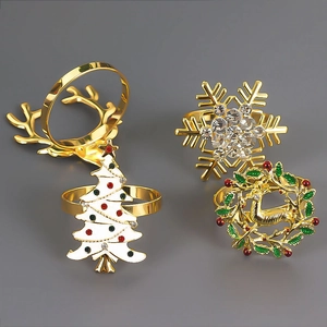 Close-up of festive Christmas napkin rings with reindeer, tree and snowflake designs