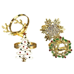 Elegant Christmas napkin rings set with gold reindeer, snowflake and white enamel tree