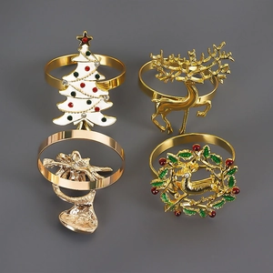 Set of 4 festive gold Christmas napkin rings featuring deer, tree, and wreath designs