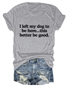 Flat lay of gray T-shirt with dog slogan and blue ripped denim shorts set
