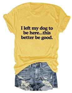 Flat lay of yellow cotton T-shirt with dog slogan and distressed denim shorts