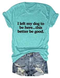Flat lay of light cyan cotton T-shirt with dog slogan and distressed denim shorts