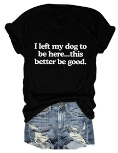 Flat lay of a black cotton t-shirt with funny dog slogan and ripped denim shorts