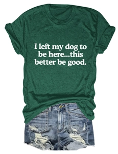 Detail of forest green cotton T-shirt featuring a funny white slogan for dog lovers