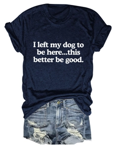 Detail of navy blue t-shirt with 'I left my dog to be here' text and denim shorts
