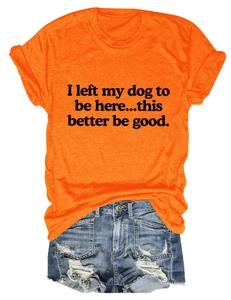 Flat lay of an orange crew neck t-shirt paired with distressed denim shorts