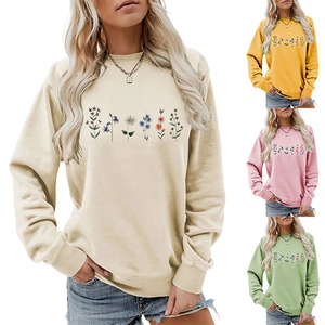 Detail of colorful wildflower prints on a comfortable crew neck long sleeve sweatshirt