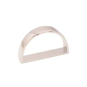 Macro view of D-shaped napkin ring showing smooth gold finish and brushed metal texture