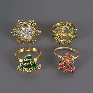 Set of 4 festive gold rhinestone Christmas napkin rings featuring tree, deer and snowflake