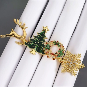 Christmas napkin ring set with gold reindeer, Xmas tree, wreath and snowflake designs