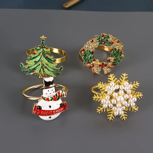 Set of 4 Christmas napkin rings with snowman, pine tree, snowflake, and wreath motifs