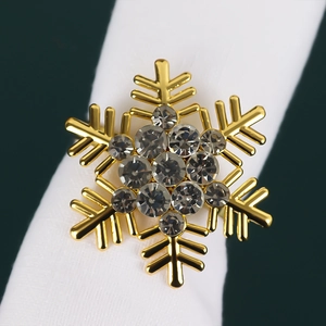 Golden snowflake napkin ring with inlaid rhinestones for elegant Christmas table setting