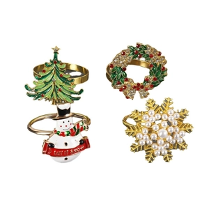 Set of 4 Christmas napkin rings with enamel snowman, tree, wreath and pearl snowflake