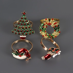 Set of 4 festive gold Christmas napkin rings with enamel tree wreath hat and boot