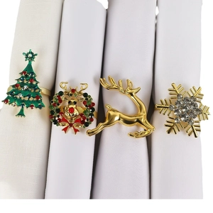 Christmas napkin ring set with gold reindeer, snowflake, tree and wreath designs