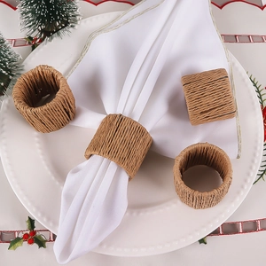 Macro detail of handmade woven napkin rings on a festive holiday table setting