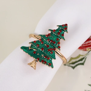 Detail of Christmas tree napkin ring with green enamel and sparkling red rhinestones